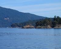 Coal Point and Deep Cove with Wain Rock and Moses Point in the distance, and Satellite Channel and Mount Tuam on Saltspring Island in the far distance.